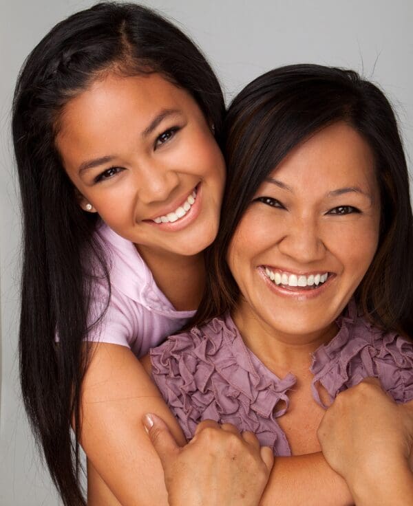 mom and daugther in loving embrace with open conversations on puberty